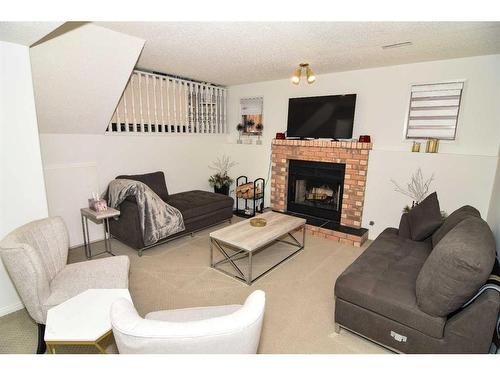 227 Costa Mesa Close Ne, Calgary, AB - Indoor Photo Showing Living Room With Fireplace