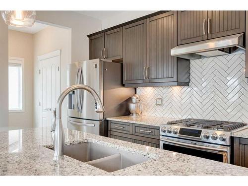 17 Marquis Heights Se, Calgary, AB - Indoor Photo Showing Kitchen With Double Sink With Upgraded Kitchen