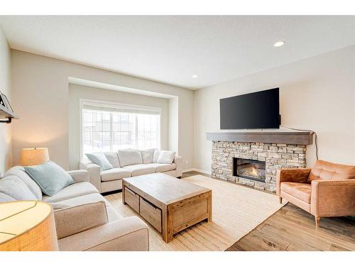 17 Marquis Heights Se, Calgary, AB - Indoor Photo Showing Living Room With Fireplace