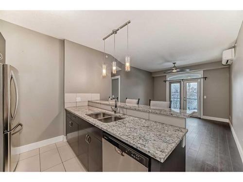 306-201 20 Avenue Ne, Calgary, AB - Indoor Photo Showing Kitchen With Stainless Steel Kitchen With Double Sink