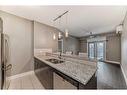 306-201 20 Avenue Ne, Calgary, AB  - Indoor Photo Showing Kitchen With Stainless Steel Kitchen With Double Sink 