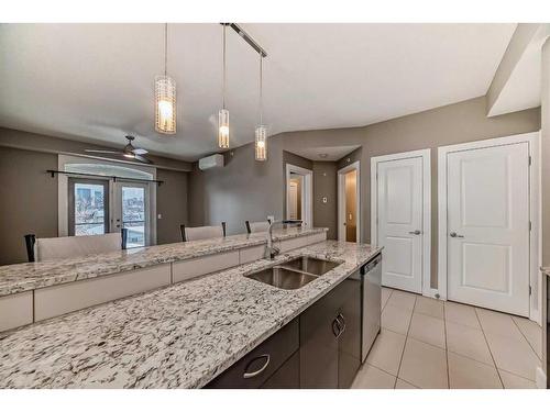 306-201 20 Avenue Ne, Calgary, AB - Indoor Photo Showing Kitchen With Double Sink