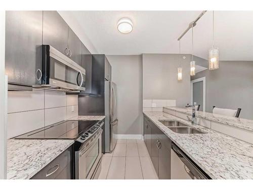 306-201 20 Avenue Ne, Calgary, AB - Indoor Photo Showing Kitchen With Stainless Steel Kitchen With Double Sink With Upgraded Kitchen