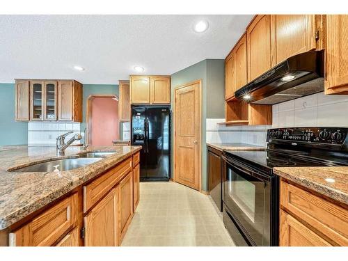 121 Mt Assiniboine Place Se, Calgary, AB - Indoor Photo Showing Kitchen With Double Sink