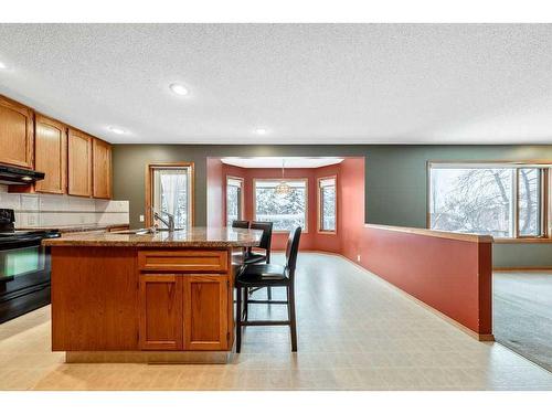 121 Mt Assiniboine Place Se, Calgary, AB - Indoor Photo Showing Kitchen With Double Sink