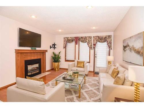 416 Sandringham Place Nw, Calgary, AB - Indoor Photo Showing Living Room With Fireplace