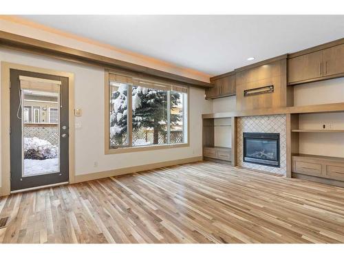 3-2421 29 Street Sw, Calgary, AB - Indoor Photo Showing Living Room With Fireplace