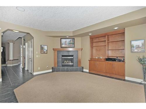 2193 Vimy Way Sw, Calgary, AB - Indoor Photo Showing Living Room With Fireplace