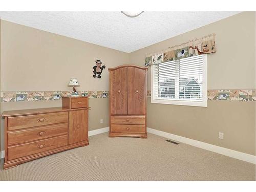 2193 Vimy Way Sw, Calgary, AB - Indoor Photo Showing Bedroom