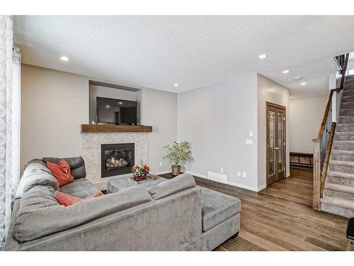 116 Auburn Glen Heights Se, Calgary, AB - Indoor Photo Showing Living Room With Fireplace