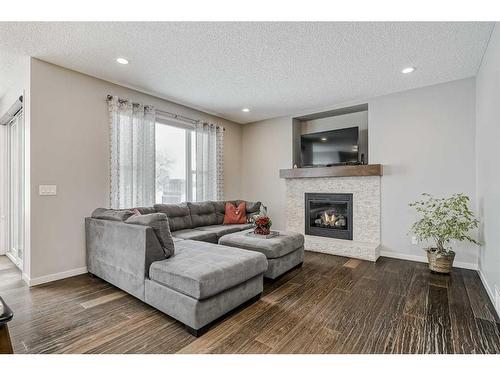 116 Auburn Glen Heights Se, Calgary, AB - Indoor Photo Showing Living Room With Fireplace