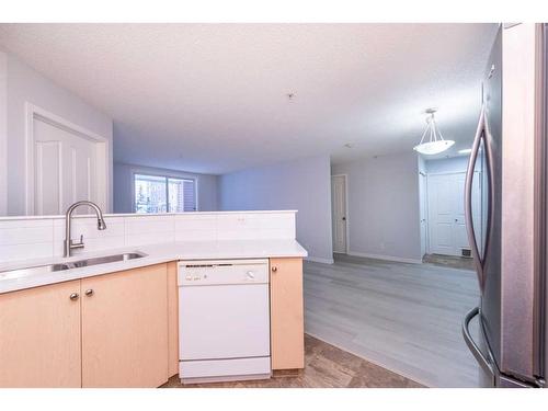 4105-10 Prestwick Bay Se, Calgary, AB - Indoor Photo Showing Kitchen With Double Sink