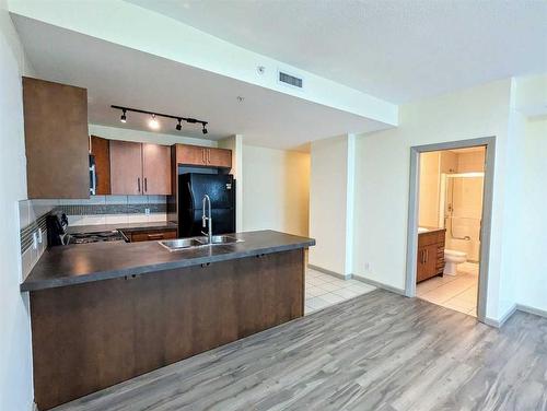 1303-210 15 Avenue Se, Calgary, AB - Indoor Photo Showing Kitchen With Double Sink