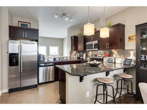 105 Evanston Square Nw, Calgary, AB - Indoor Photo Showing Kitchen With Stainless Steel Kitchen With Double Sink With Upgraded Kitchen