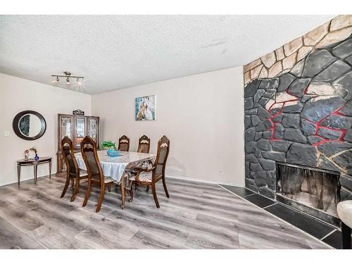 2815 12 Avenue Se, Calgary, AB - Indoor Photo Showing Dining Room With Fireplace