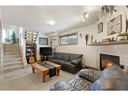 63 Coverdale Way Ne, Calgary, AB - Indoor Photo Showing Living Room With Fireplace