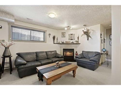 63 Coverdale Way Ne, Calgary, AB - Indoor Photo Showing Living Room With Fireplace