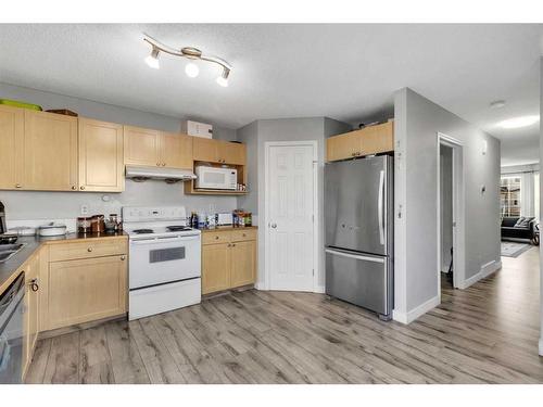 138 Tarawood Road Ne, Calgary, AB - Indoor Photo Showing Kitchen With Double Sink