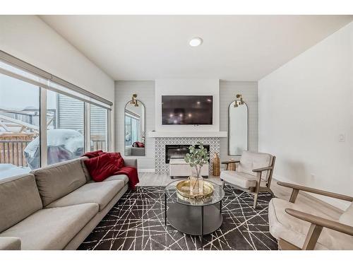 166 Creekstone Way Sw, Calgary, AB - Indoor Photo Showing Living Room With Fireplace