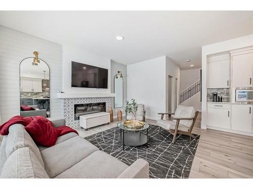 166 Creekstone Way Sw, Calgary, AB - Indoor Photo Showing Living Room With Fireplace