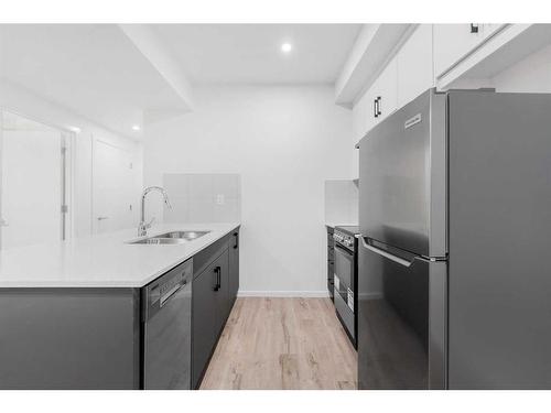 46 Cityline Mount Ne, Calgary, AB - Indoor Photo Showing Kitchen With Stainless Steel Kitchen With Double Sink