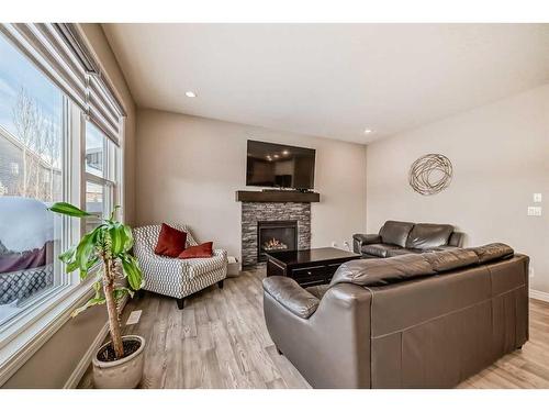 35 Legacy Link Se, Calgary, AB - Indoor Photo Showing Living Room With Fireplace