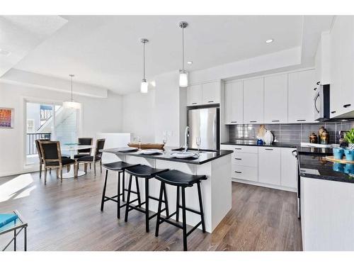 425-115 Sagewood Drive, Airdrie, AB - Indoor Photo Showing Kitchen With Stainless Steel Kitchen With Upgraded Kitchen