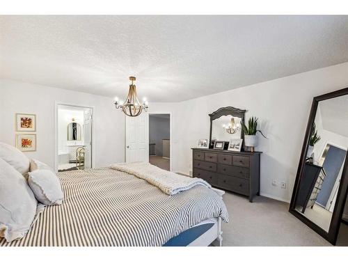 117 Drake Landing View, Okotoks, AB - Indoor Photo Showing Bedroom