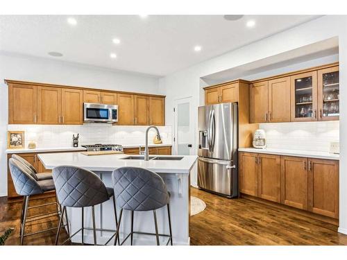 117 Drake Landing View, Okotoks, AB - Indoor Photo Showing Kitchen With Stainless Steel Kitchen With Double Sink With Upgraded Kitchen