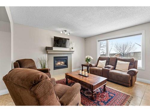 168 Edgebrook Park Nw, Calgary, AB - Indoor Photo Showing Living Room With Fireplace