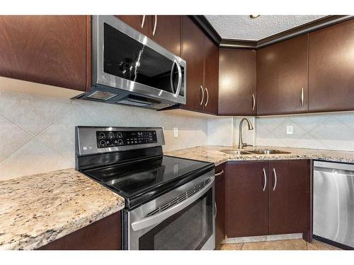 168 Edgebrook Park Nw, Calgary, AB - Indoor Photo Showing Kitchen With Stainless Steel Kitchen With Double Sink