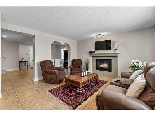 168 Edgebrook Park Nw, Calgary, AB - Indoor Photo Showing Living Room With Fireplace