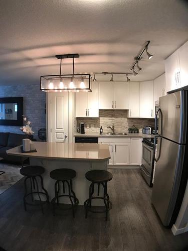 239 Mckenzie Towne Square Se, Calgary, AB - Indoor Photo Showing Kitchen With Stainless Steel Kitchen