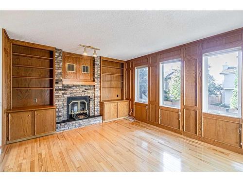 307 Hawkview Manor Circle Nw, Calgary, AB - Indoor Photo Showing Living Room With Fireplace