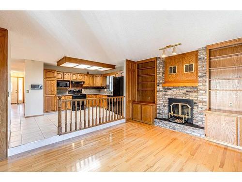 307 Hawkview Manor Circle Nw, Calgary, AB - Indoor Photo Showing Other Room With Fireplace