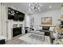 122 Osborne Rise Sw, Airdrie, AB  - Indoor Photo Showing Living Room With Fireplace 