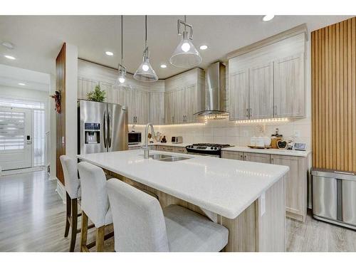 122 Osborne Rise Sw, Airdrie, AB - Indoor Photo Showing Kitchen With Stainless Steel Kitchen With Double Sink With Upgraded Kitchen