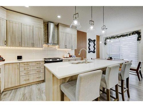 122 Osborne Rise Sw, Airdrie, AB - Indoor Photo Showing Kitchen With Double Sink With Upgraded Kitchen