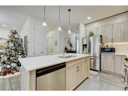 122 Osborne Rise Sw, Airdrie, AB - Indoor Photo Showing Kitchen With Stainless Steel Kitchen With Double Sink With Upgraded Kitchen