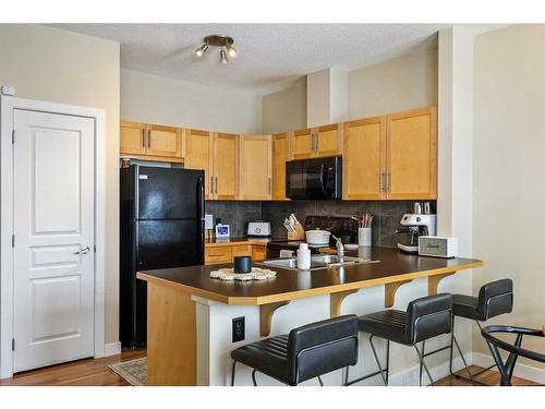 79 Panatella Hill Nw, Calgary, AB - Indoor Photo Showing Kitchen With Double Sink