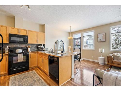 79 Panatella Hill Nw, Calgary, AB - Indoor Photo Showing Kitchen With Double Sink