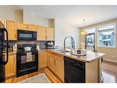 79 Panatella Hill Nw, Calgary, AB - Indoor Photo Showing Kitchen With Double Sink