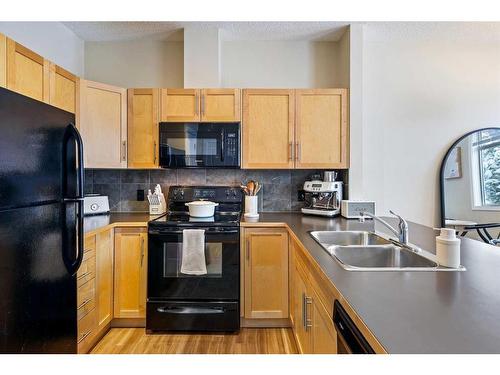 79 Panatella Hill Nw, Calgary, AB - Indoor Photo Showing Kitchen With Double Sink