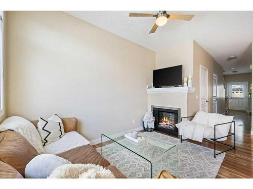 79 Panatella Hill Nw, Calgary, AB - Indoor Photo Showing Living Room With Fireplace