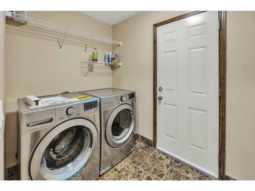 1920 New Brighton Drive Se, Calgary, AB - Indoor Photo Showing Laundry Room