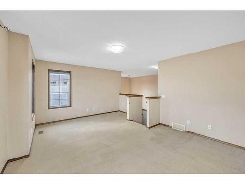 1920 New Brighton Drive Se, Calgary, AB - Indoor Photo Showing Other Room