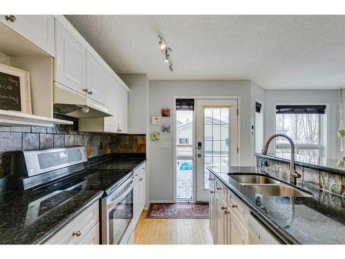 30 Covewood Place Ne, Calgary, AB - Indoor Photo Showing Kitchen With Double Sink