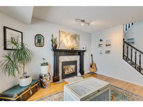 30 Covewood Place Ne, Calgary, AB - Indoor Photo Showing Living Room With Fireplace