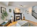 30 Covewood Place Ne, Calgary, AB  - Indoor Photo Showing Living Room With Fireplace 