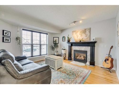 30 Covewood Place Ne, Calgary, AB - Indoor Photo Showing Living Room With Fireplace